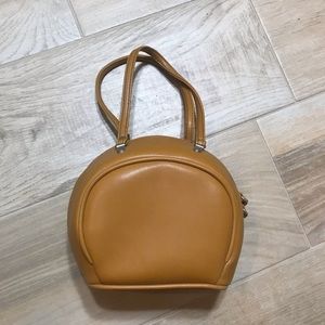 Camel color rounded handbag